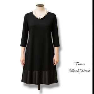 Elegant Black Dress with Pearl Necklace